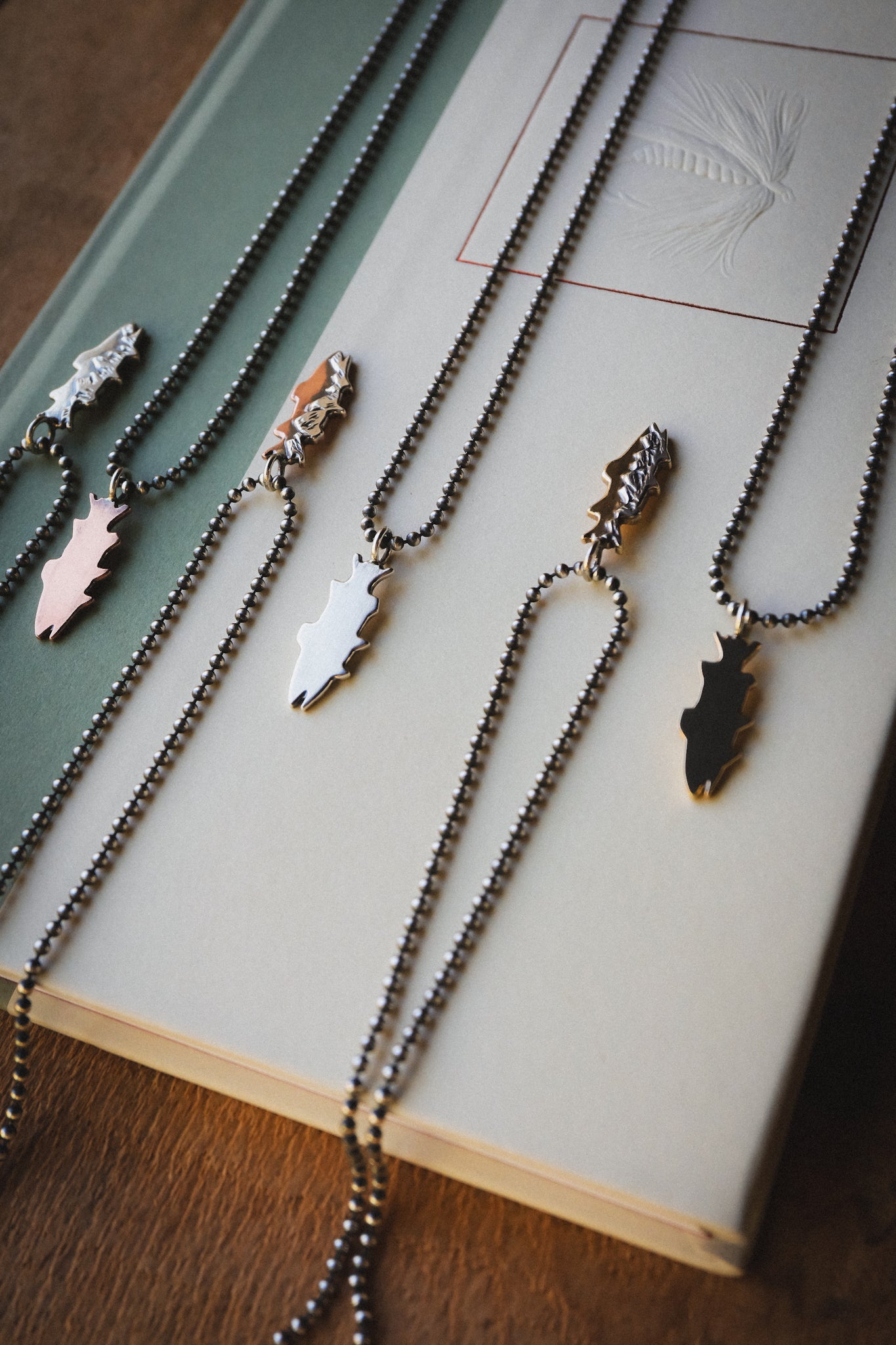 the Mountain Trout Necklace (brass + sterling silver)