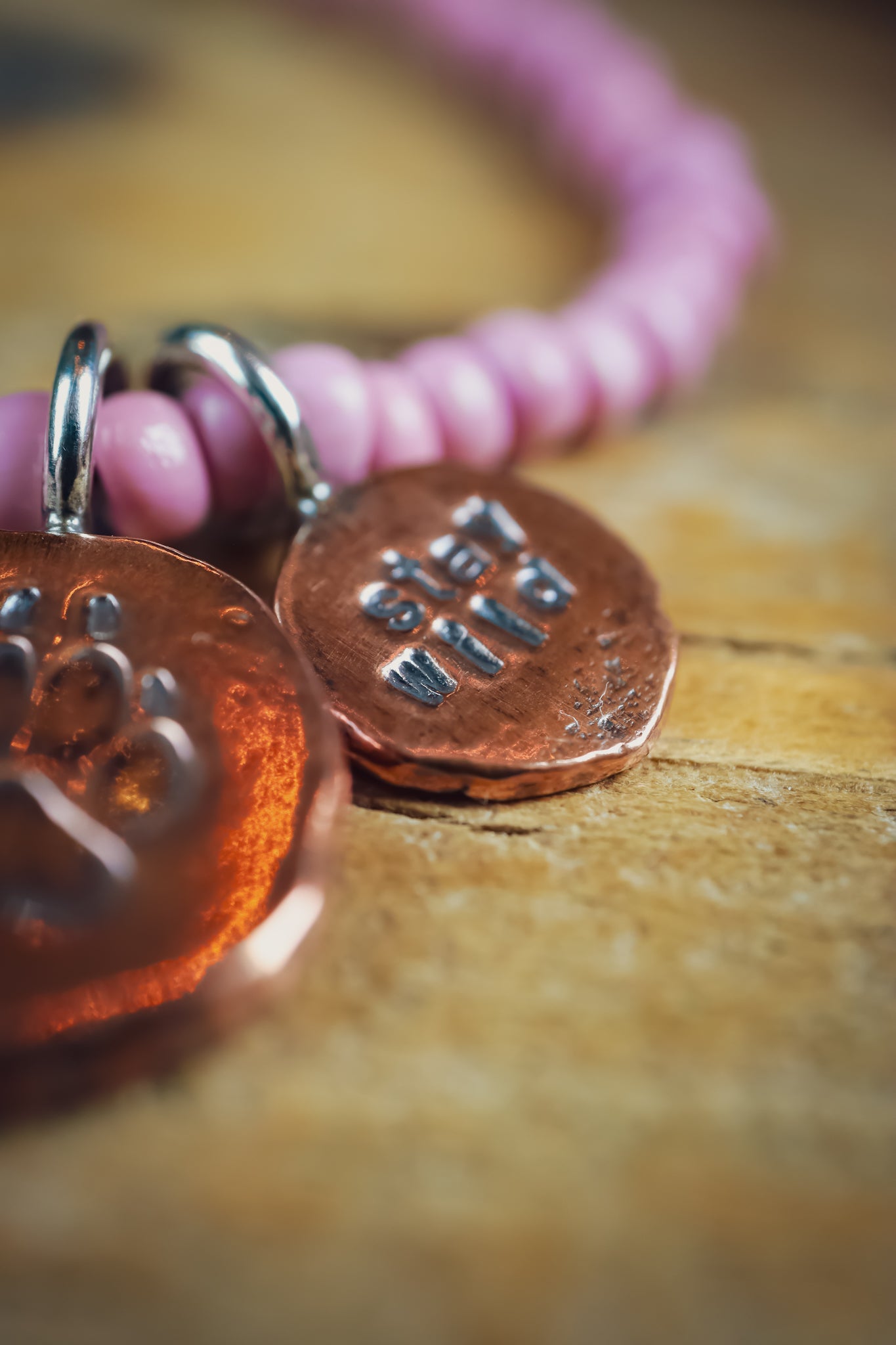 the Stay Wild Wolf Track Beaded Necklace (copper)
