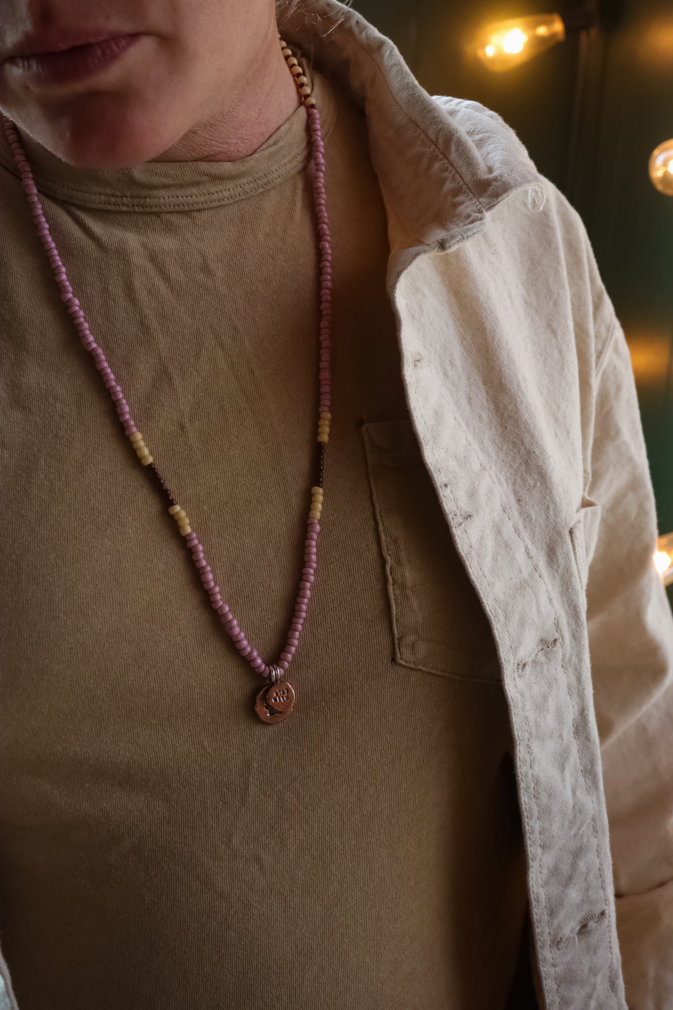 the Stay Wild Wolf Track Beaded Necklace (copper)