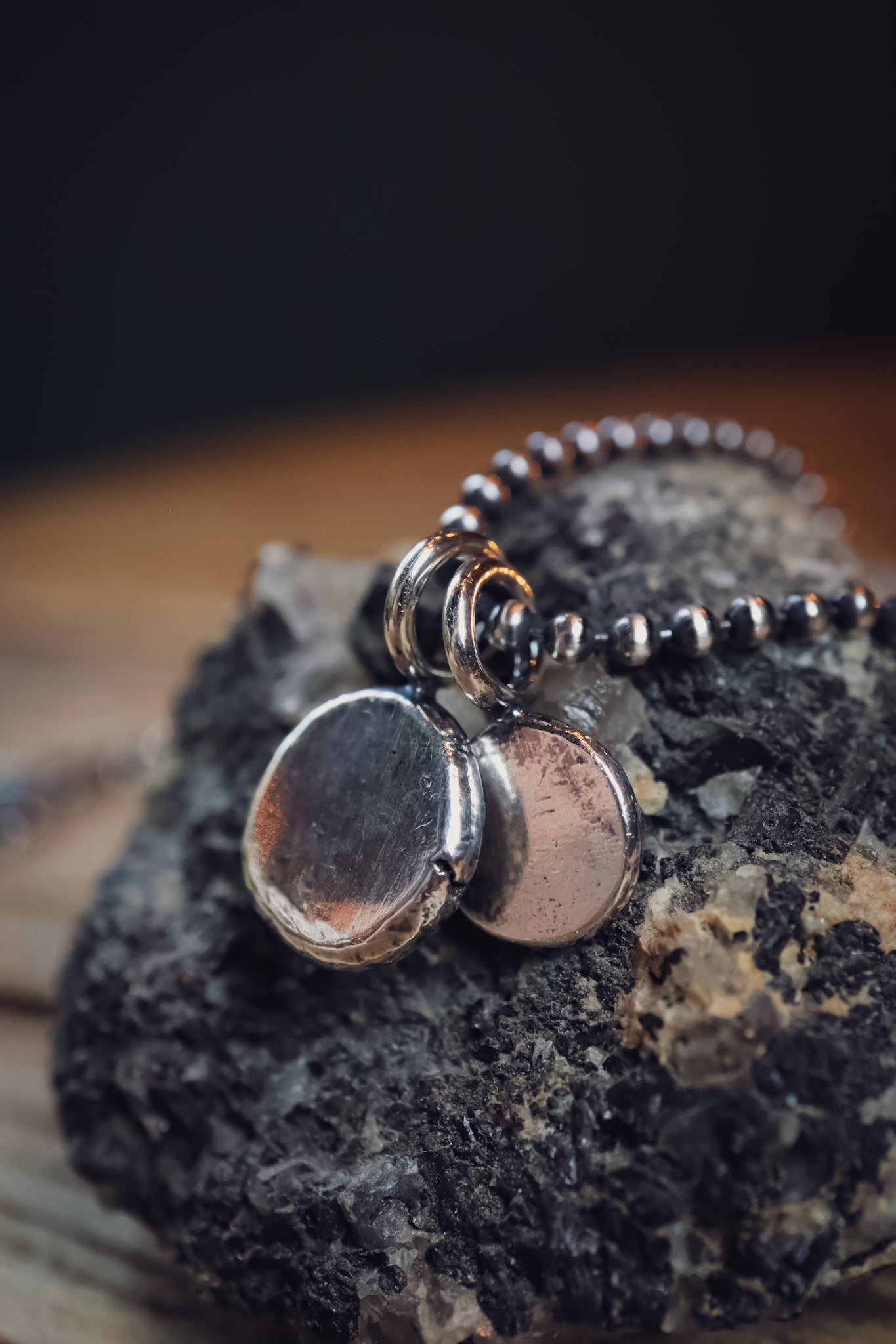 the Stay Wild Bear Track Necklace (reclaimed sterling silver)