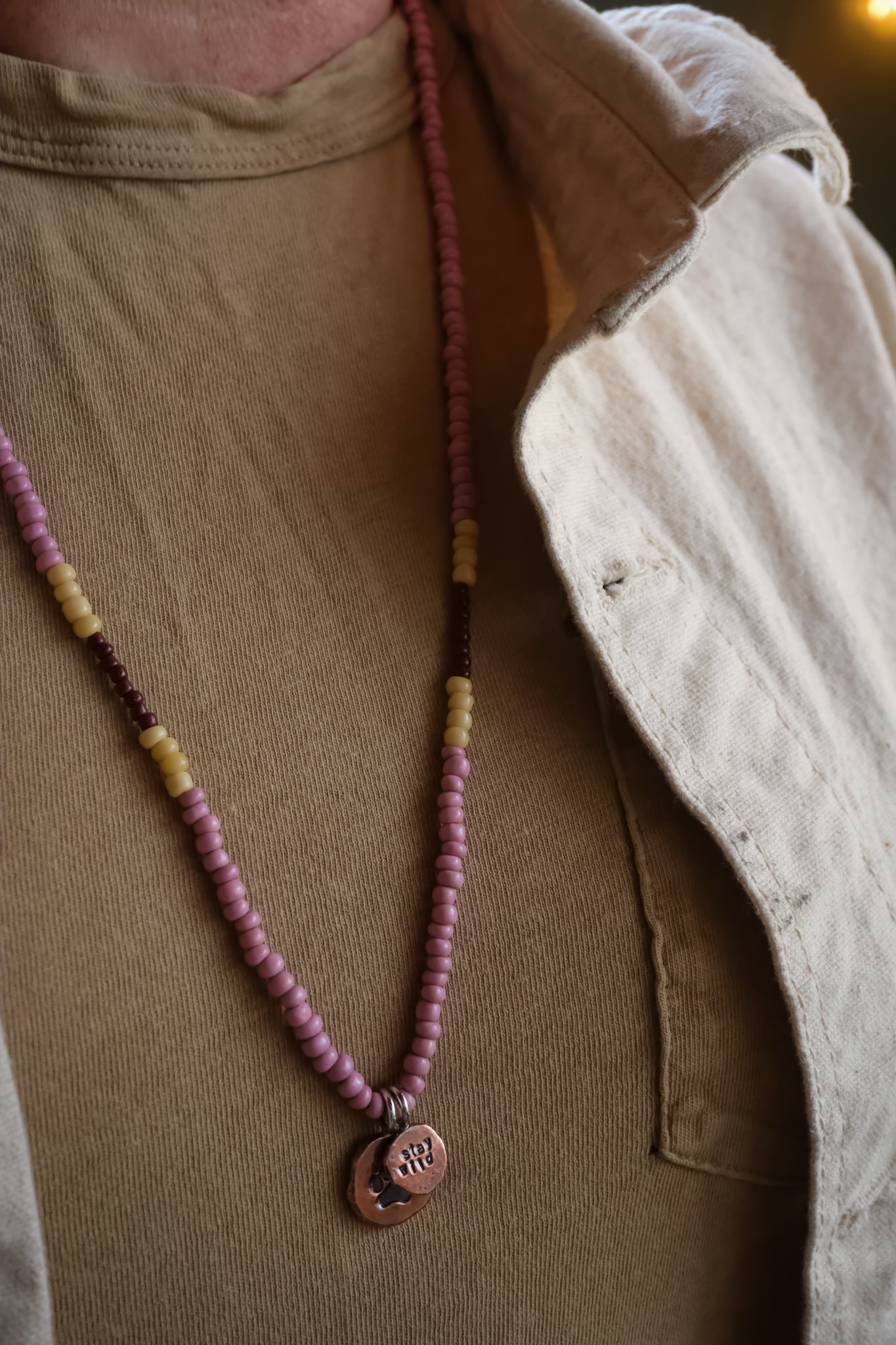 the Stay Wild Wolf Track Beaded Necklace (copper)