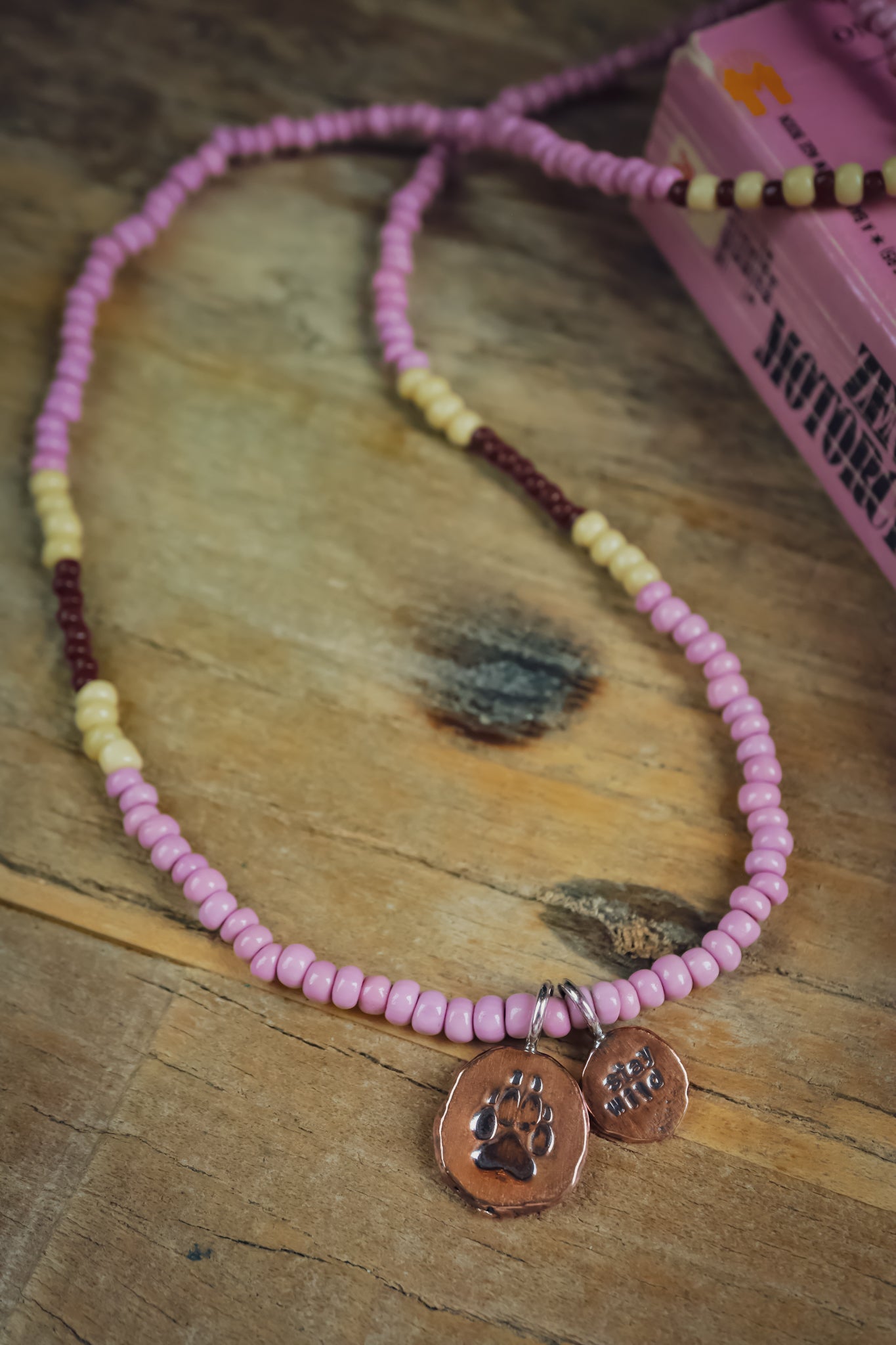 the Stay Wild Wolf Track Beaded Necklace (copper)