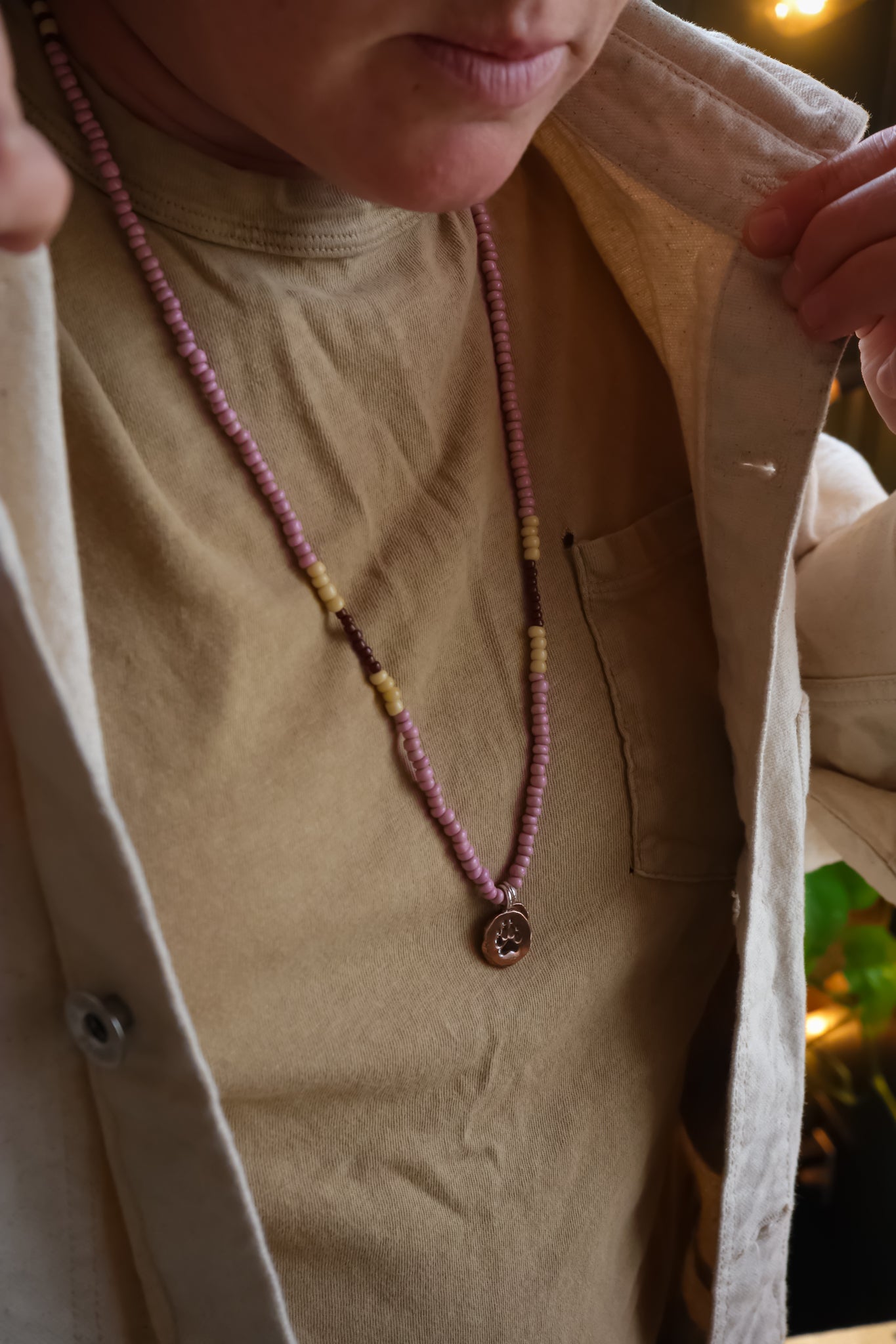 the Stay Wild Wolf Track Beaded Necklace (copper)