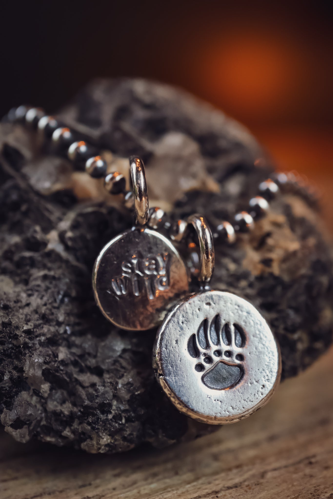 the Stay Wild Bear Track Necklace (reclaimed sterling silver)