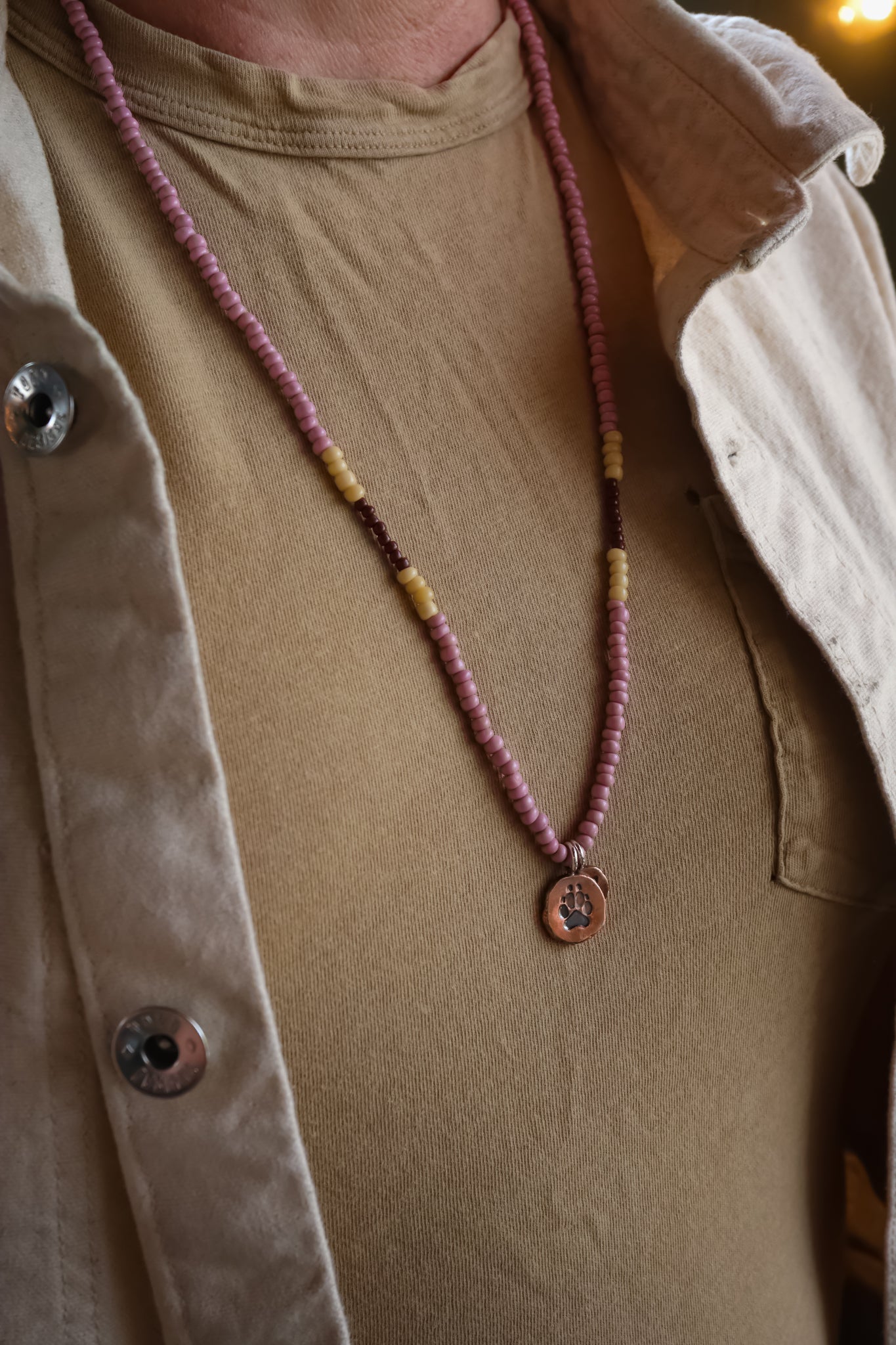 the Stay Wild Wolf Track Beaded Necklace (copper)