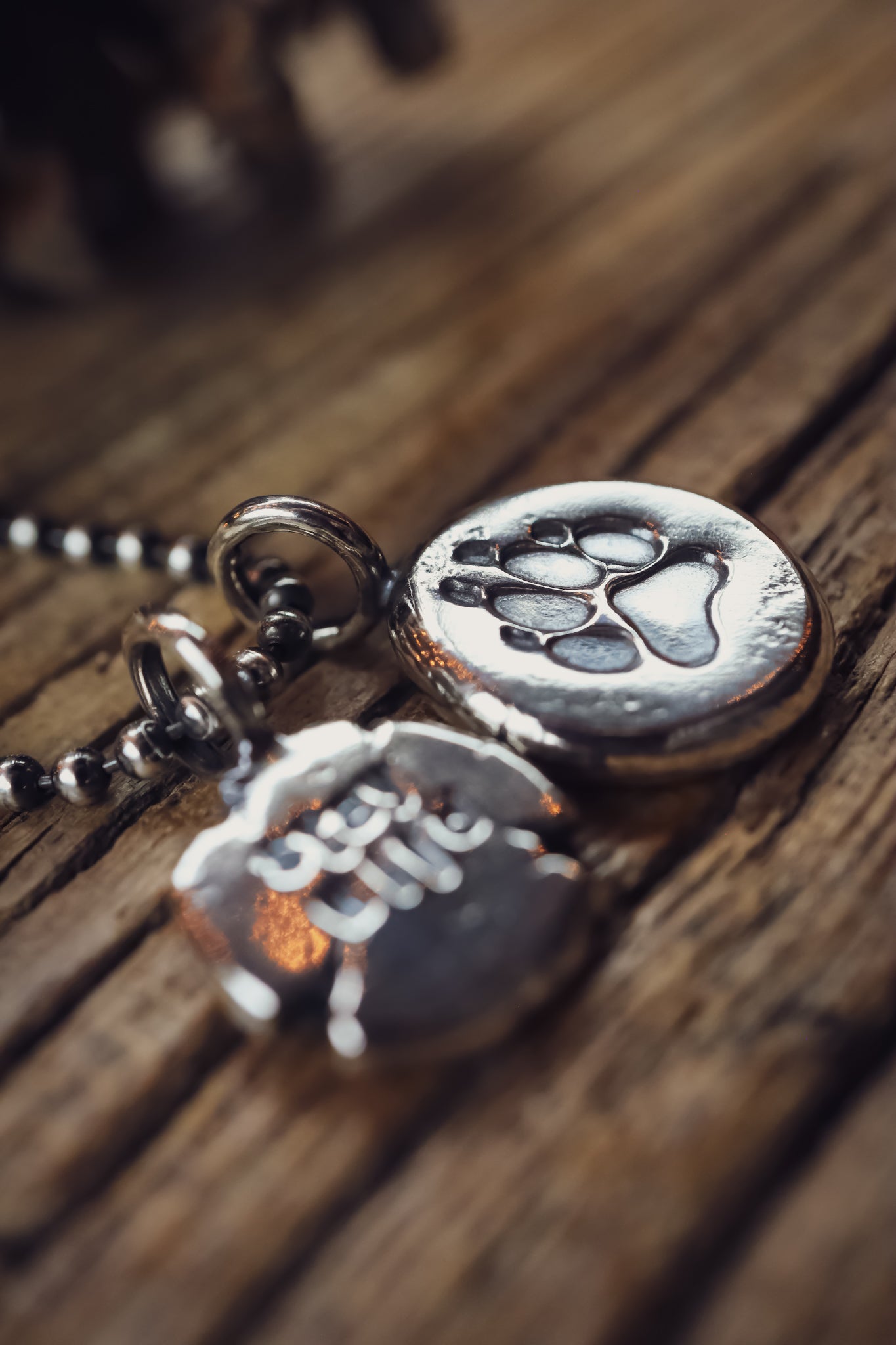 the Stay Wild Wolf Track Necklace (reclaimed sterling silver)