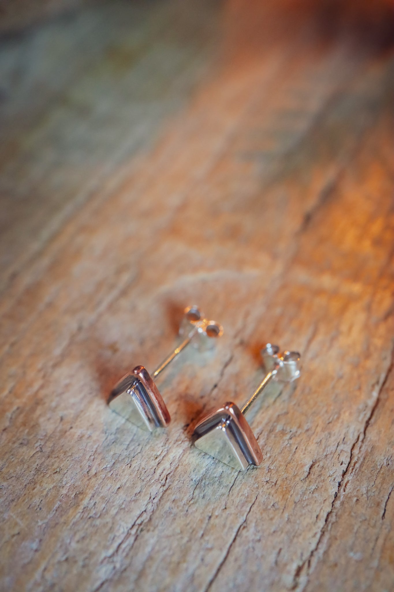 the Geo Mountain Earrings (copper + silver)